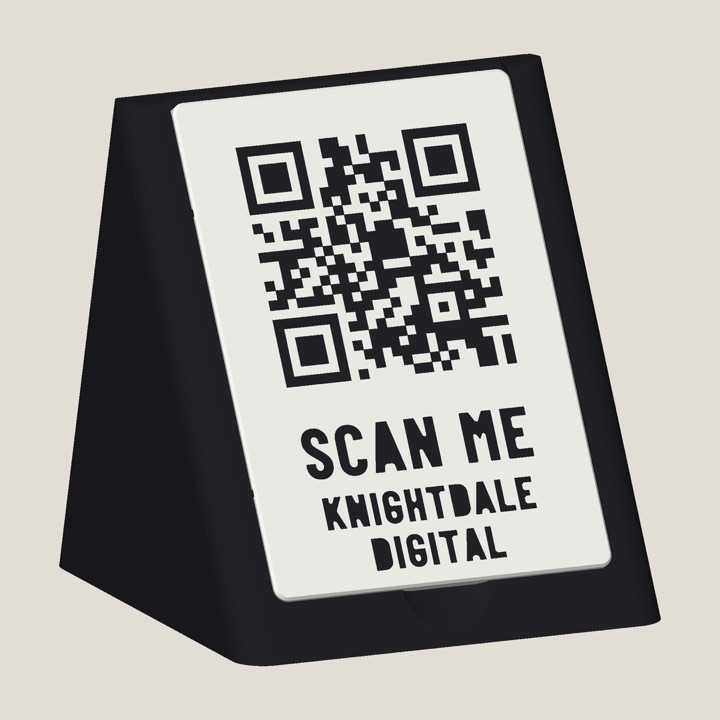 The wedge: a black 3D-printed QR sign with a white tile reading SCAN ME